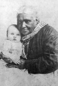 1879, Louisa Taylor holding Helen Chenoweth Stites